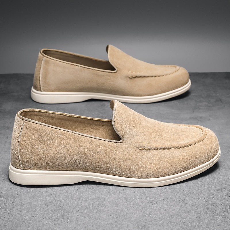 Men's black and beige slip-on loafer with white sole, black lifestyle shot