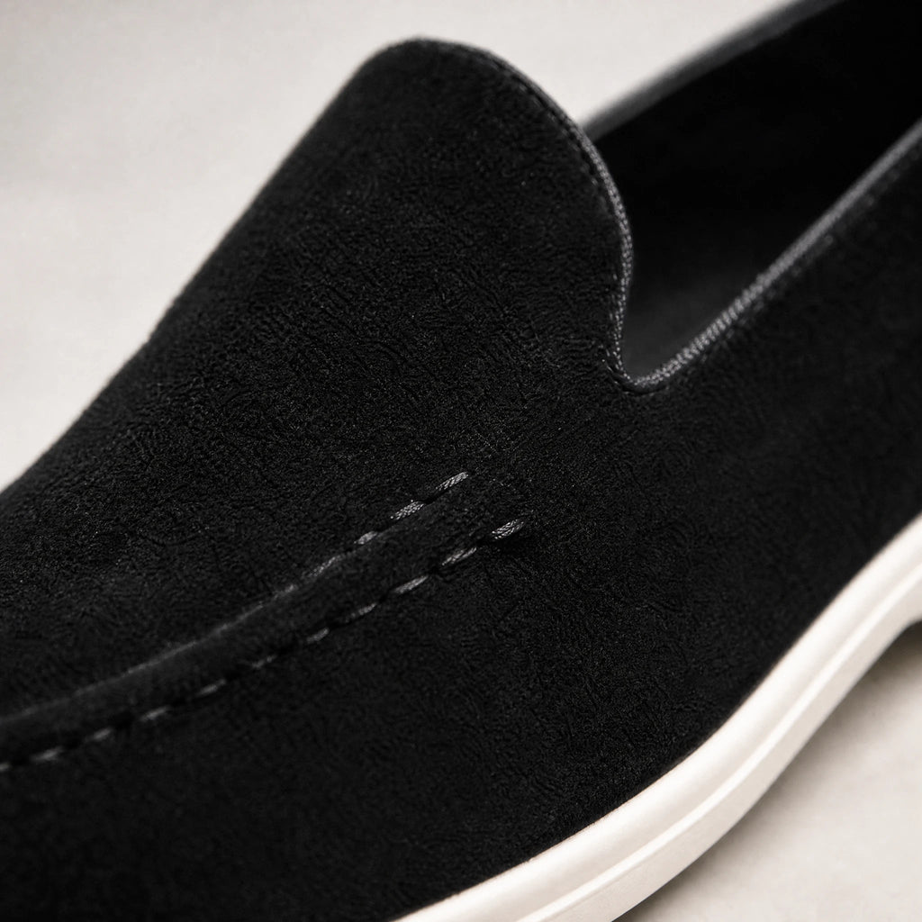 Men's black and beige slip-on loafer with white sole, beige side view