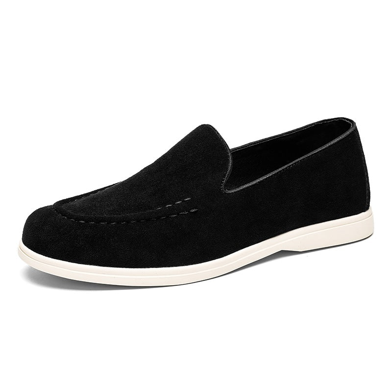 Men's black and beige slip-on loafer with white sole, black close-up of the sole