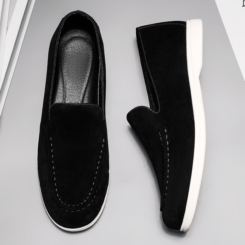 Men's black and beige slip-on loafer with white sole, black inner view
