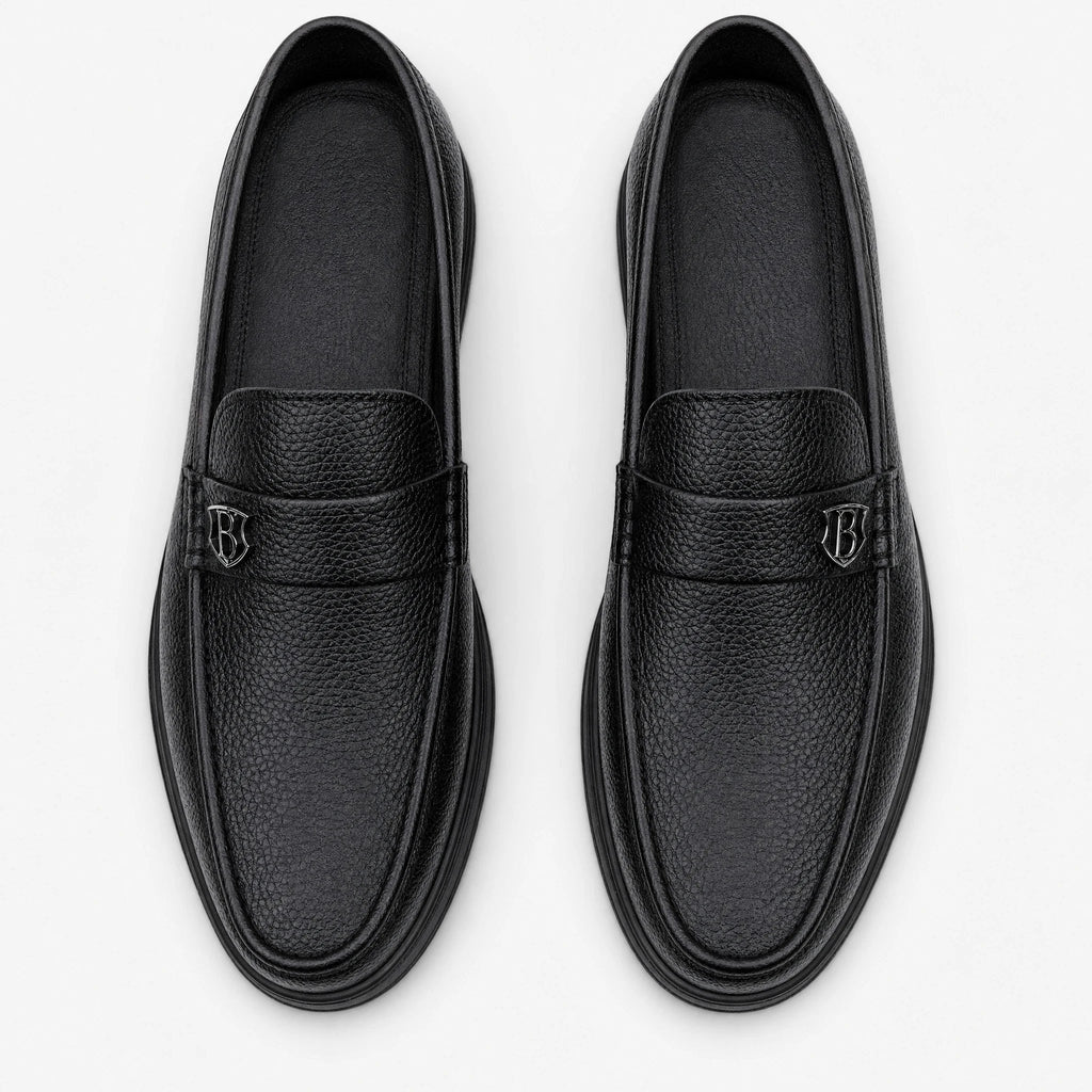 Men's black grained leather thick-sole moccasins, side view