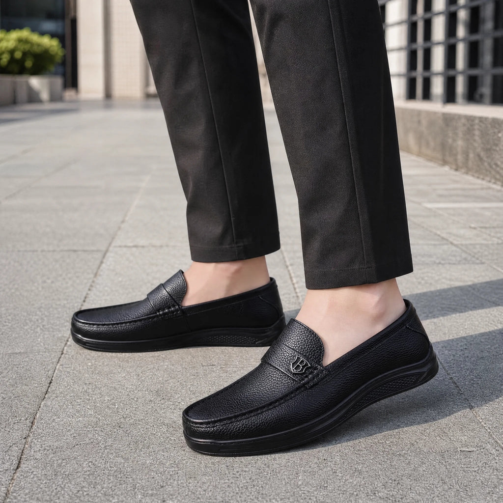 Pair of men's black moccasins, top view