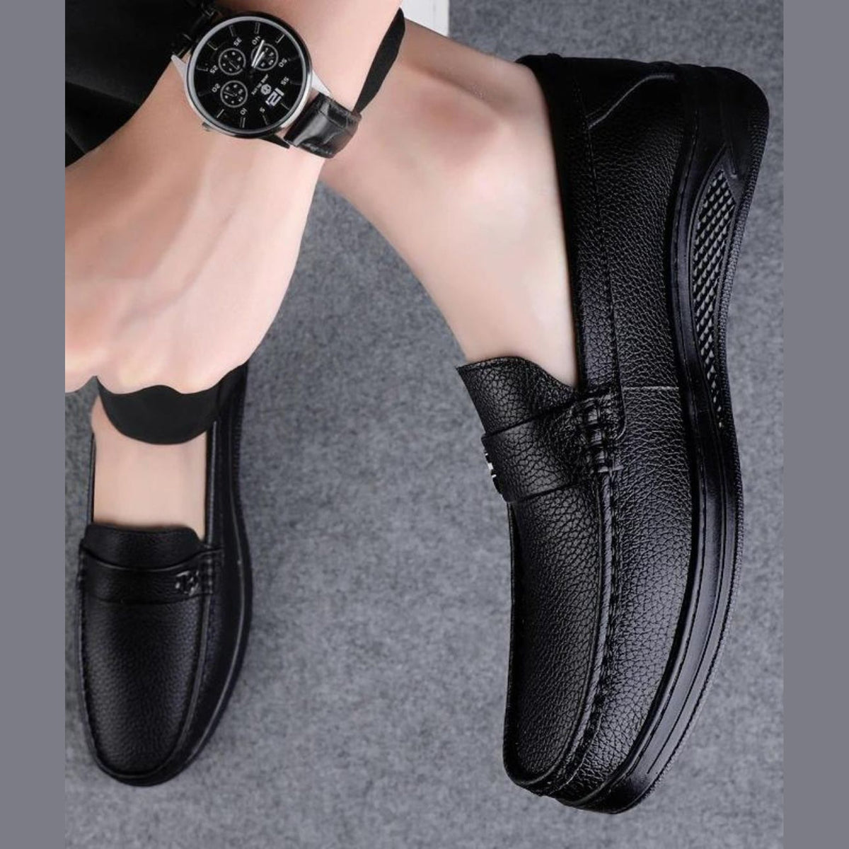 Men's black moccasins worn with chinos