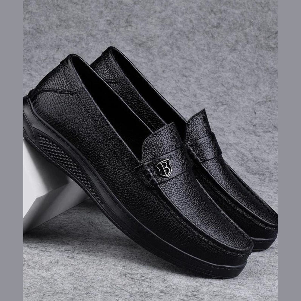Men's black moccasins worn with jeans