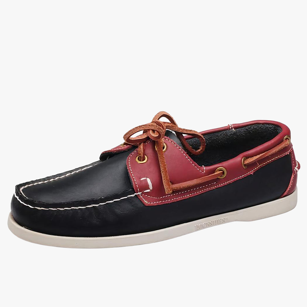 Black and red boat loafer on white background.