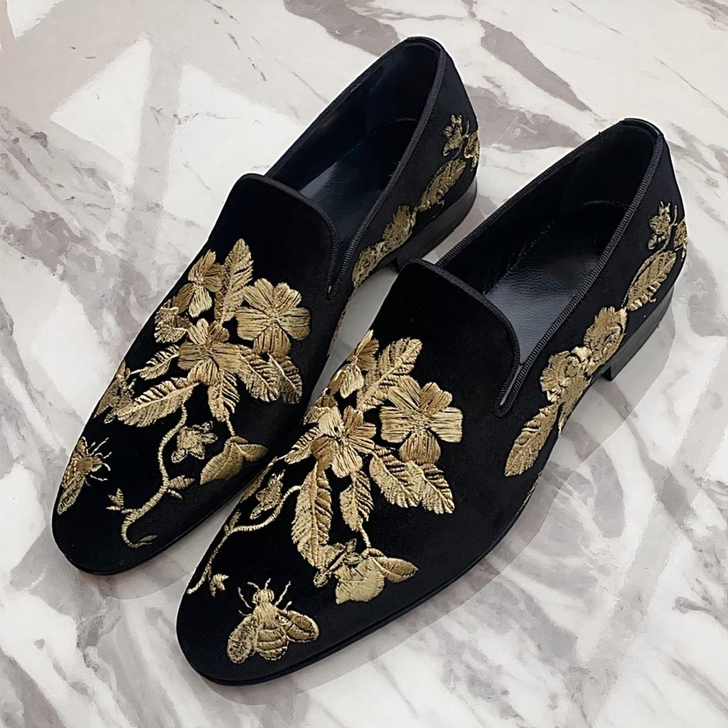 Black velvet loafers with gold floral embroidery