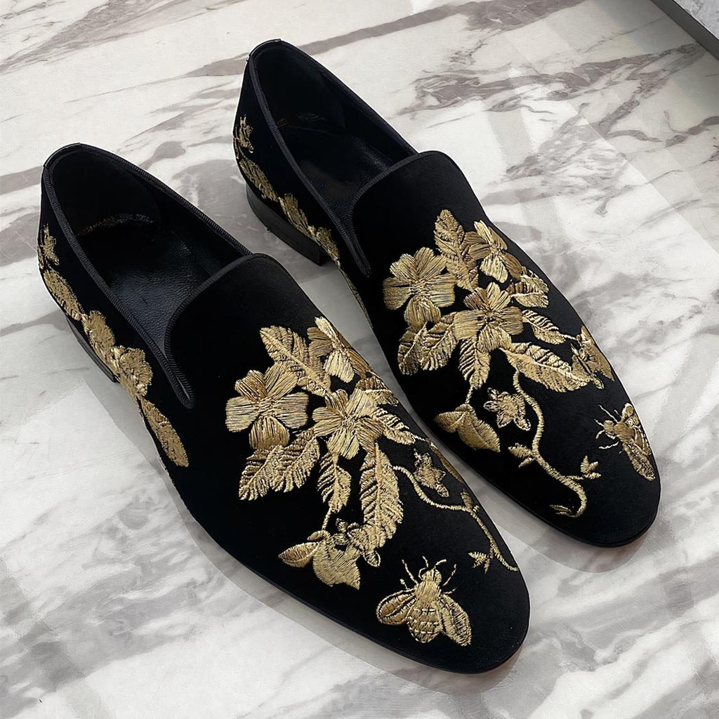 Black velvet loafers with gold floral embroidery