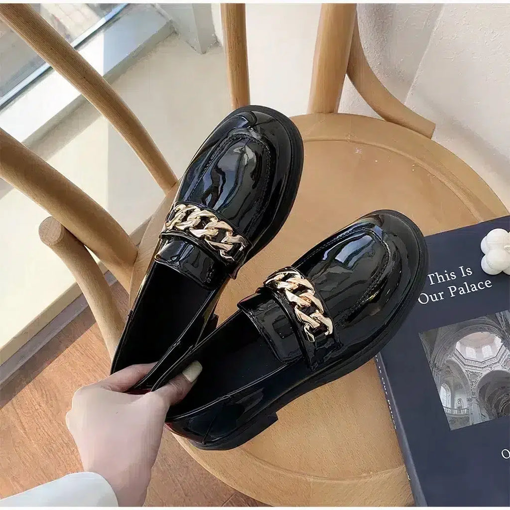 Patent loafers with small heels and chain
