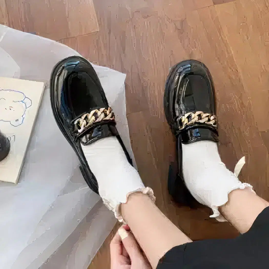Patent loafers with small heels and chain