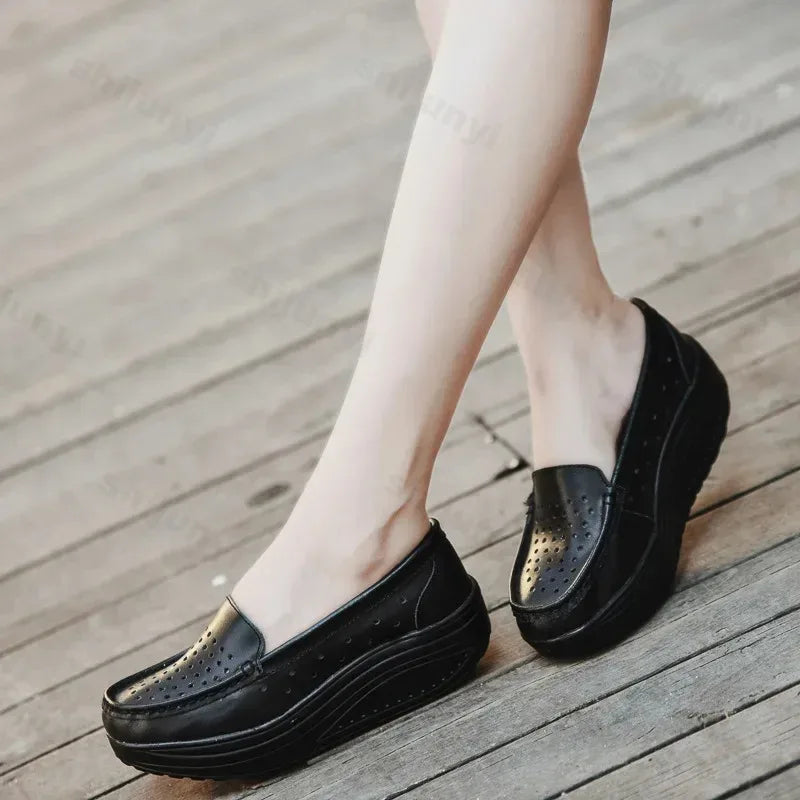 Perforated platform loafers with thick sole in Black, side view