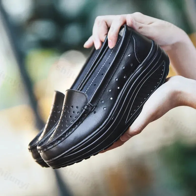 Perforated platform loafers with thick sole in Blue, back view