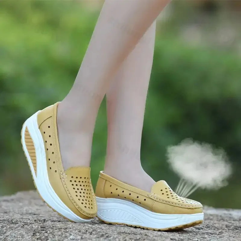 Perforated platform loafers with thick sole in Black, detail view