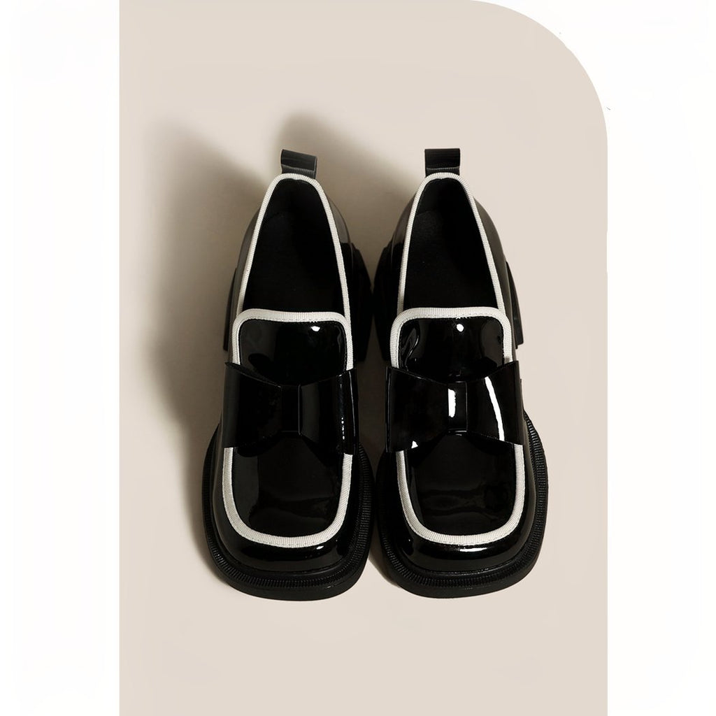 Platform loafers adorned with a ravishing black bow tie for women