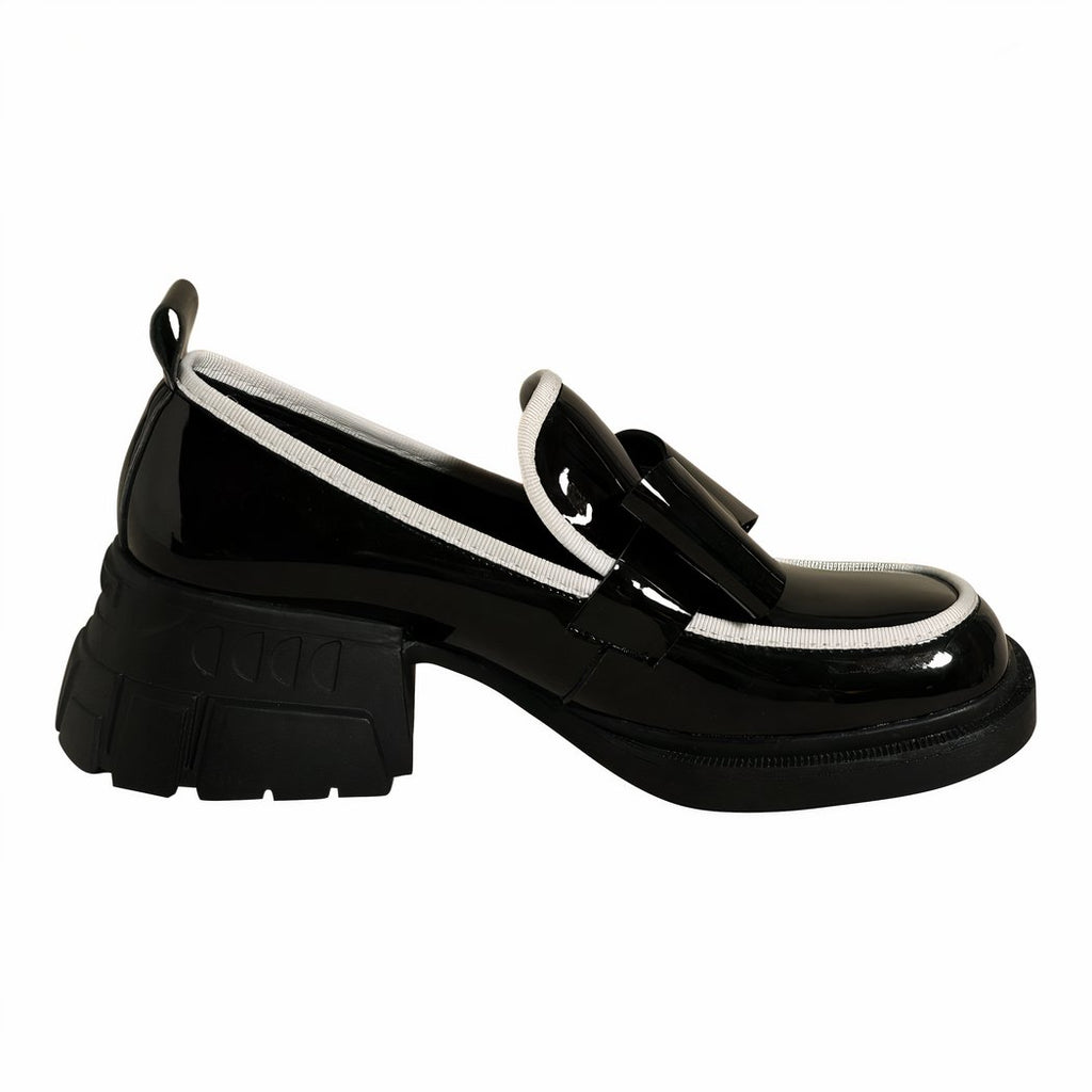 Platform loafers adorned with a ravishing black bow tie for women