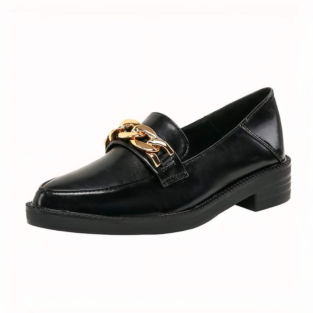 Black patent leather loafer with decorative gold chain on a white background