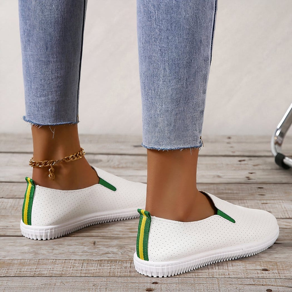 Soft loafers in perforated white synthetic leather