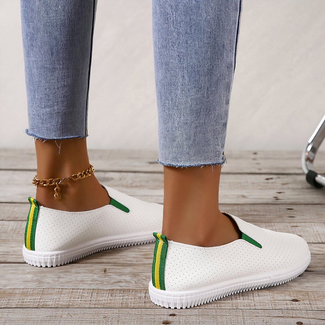 Soft loafers in perforated white synthetic leather