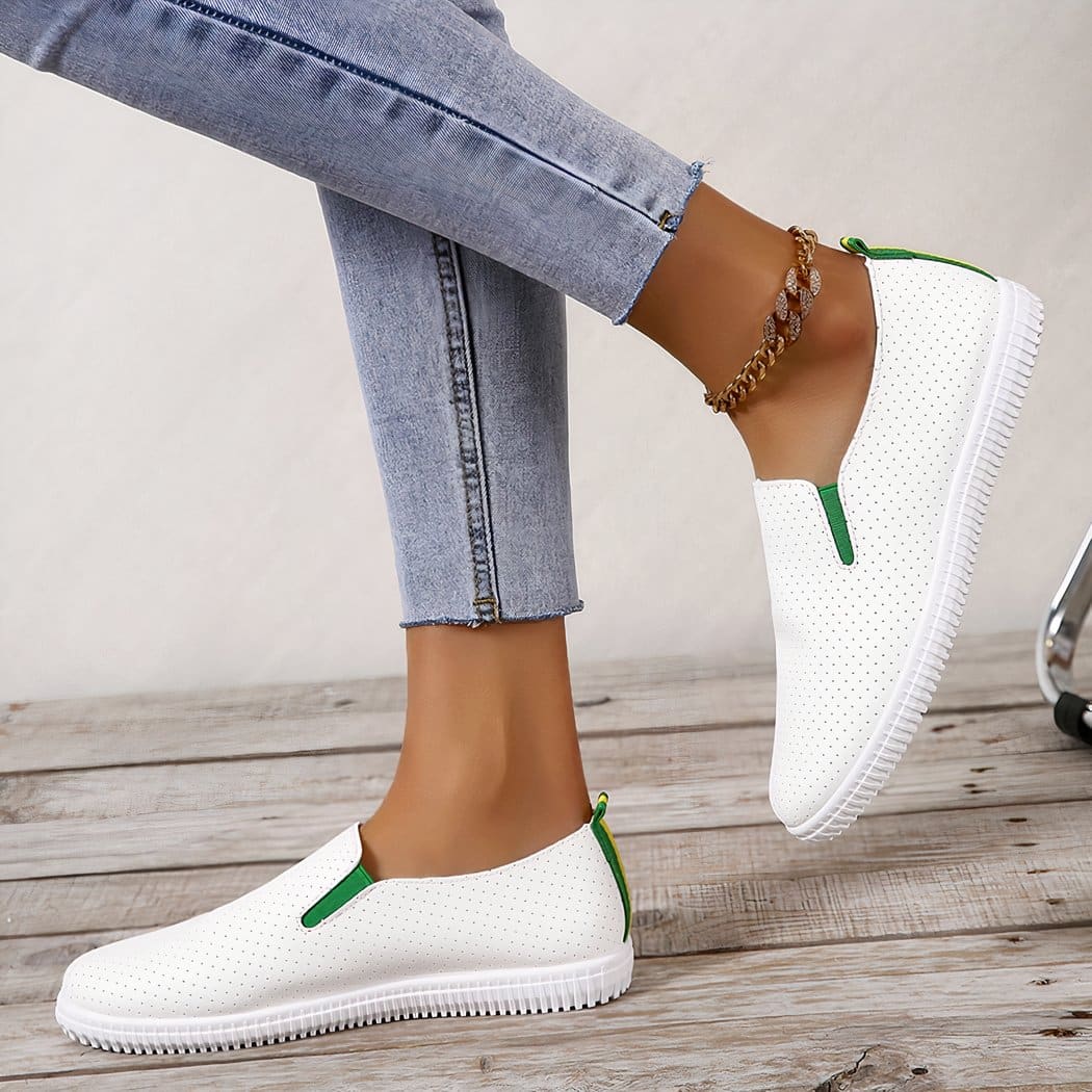 Soft loafers in perforated white synthetic leather