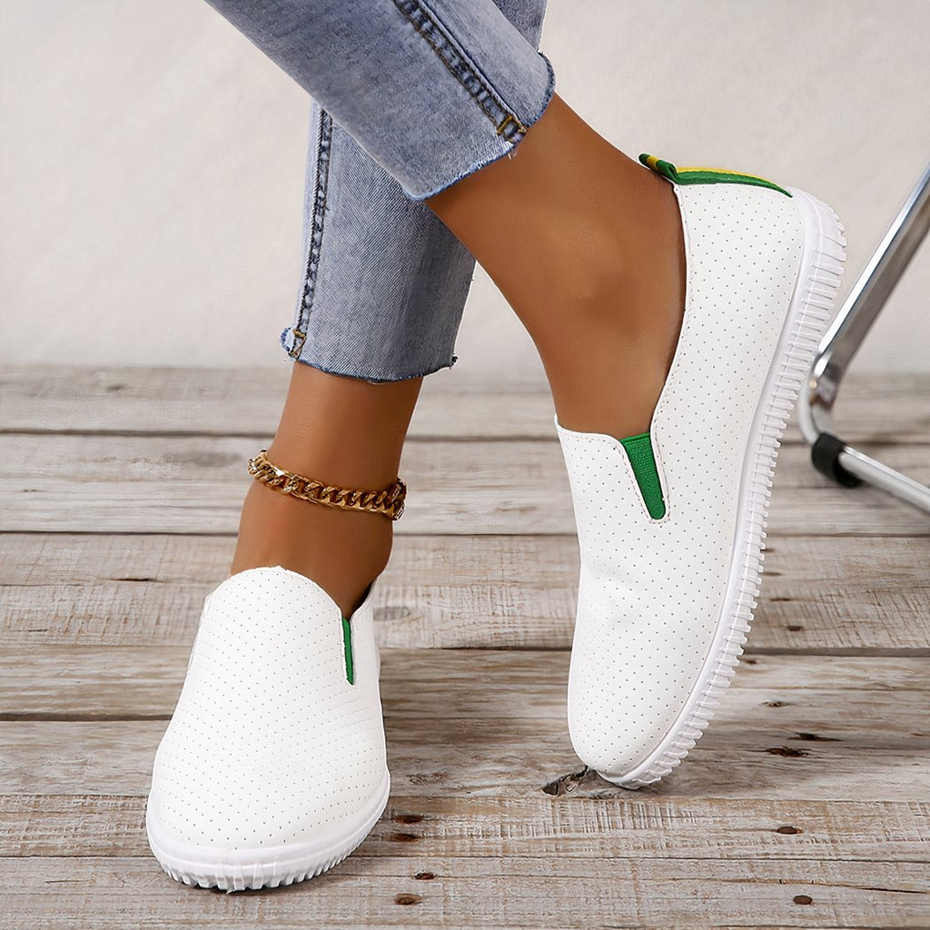 Soft loafers in perforated white synthetic leather