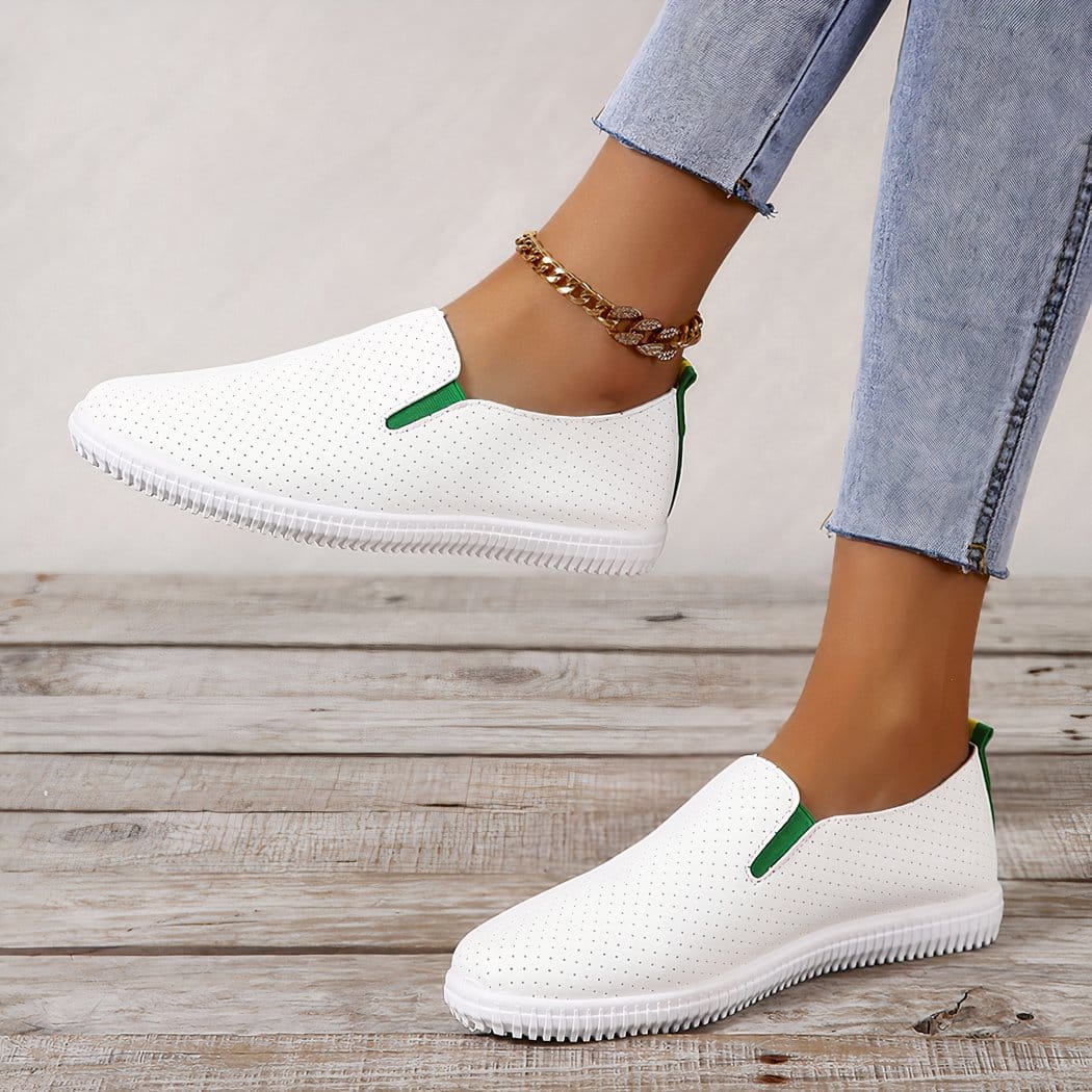 Soft loafers in perforated white synthetic leather