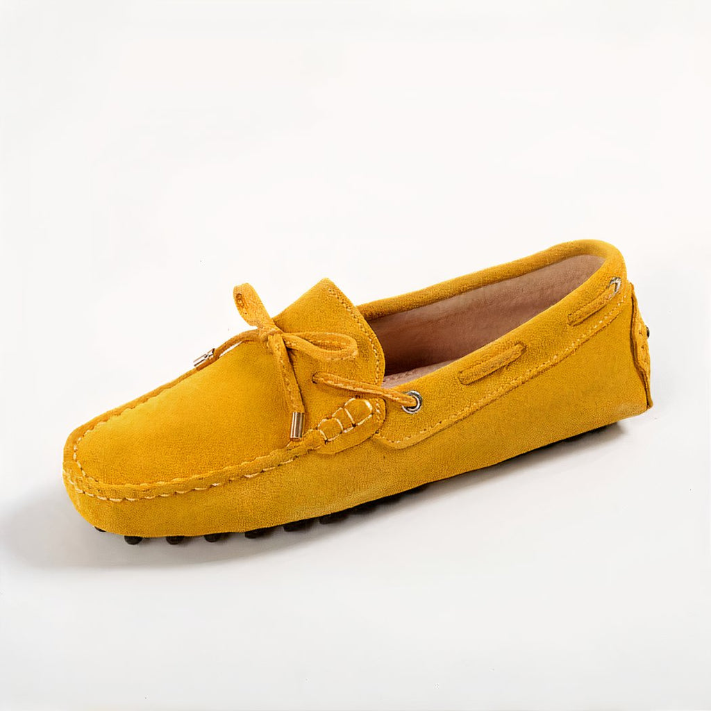 Yellow loafer on white background.