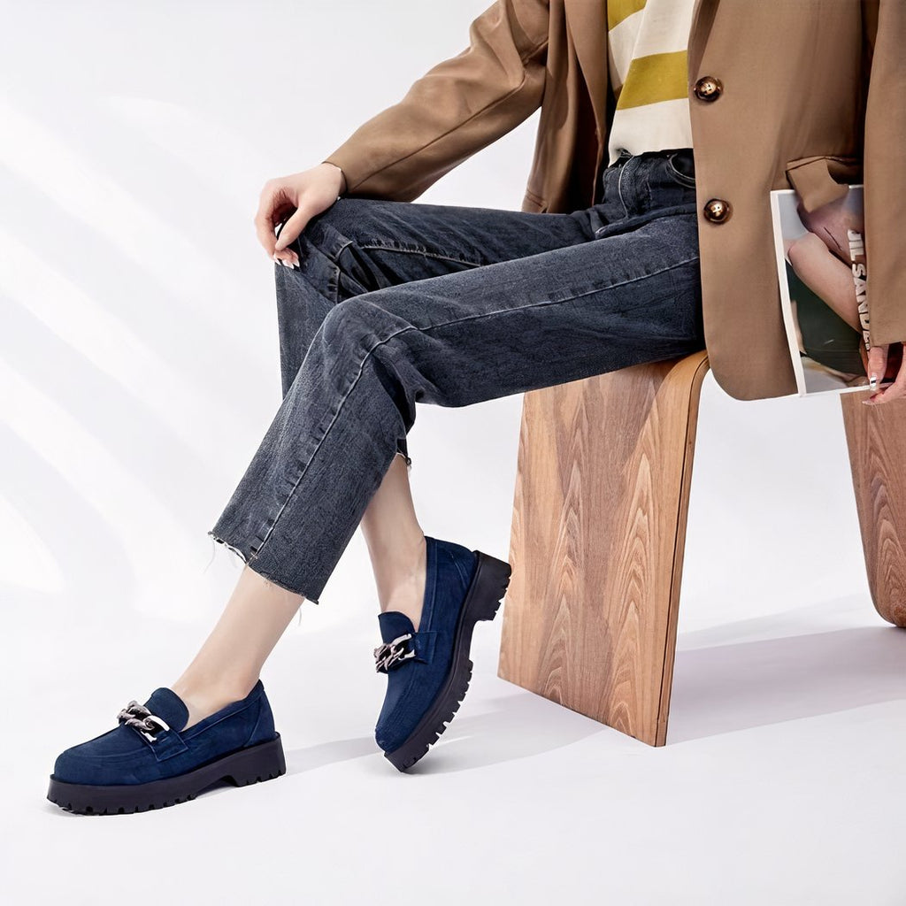 Suede loafers with gold buckle and thick sole