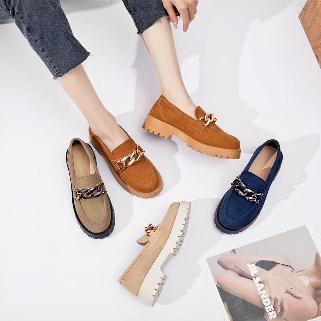 Suede loafers with gold buckle and thick sole