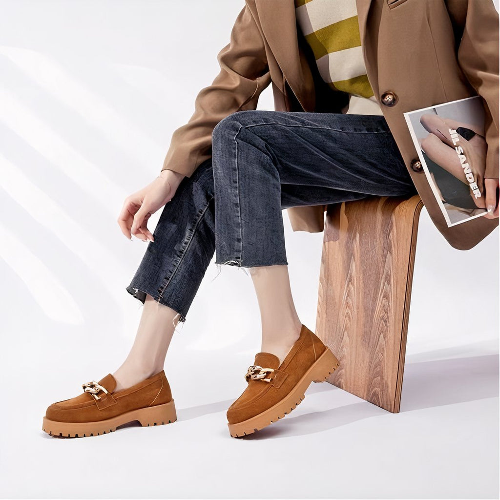 Suede loafers with gold buckle and thick sole