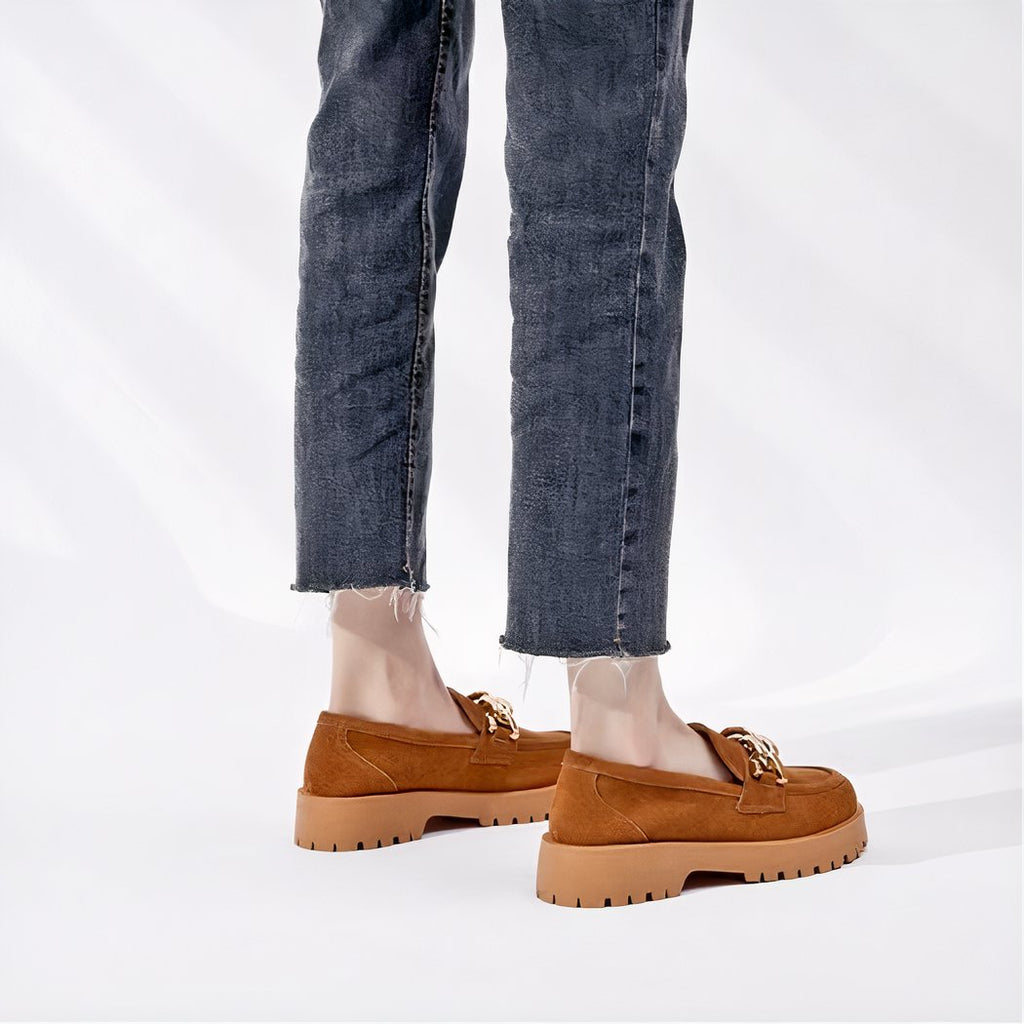 Suede loafers with gold buckle and thick sole