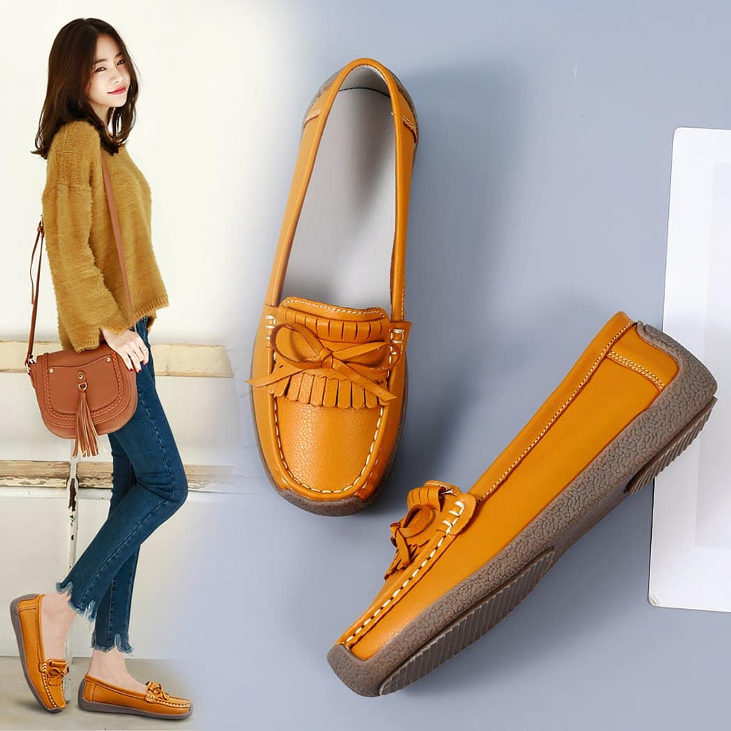 Synthetic leather loafers with fringe and bow