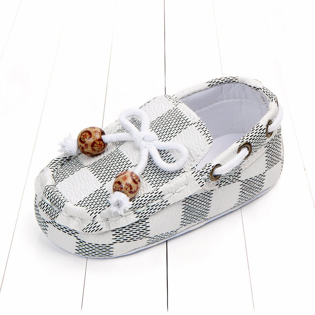 Trendy checkered baby moccasins with decorative beads