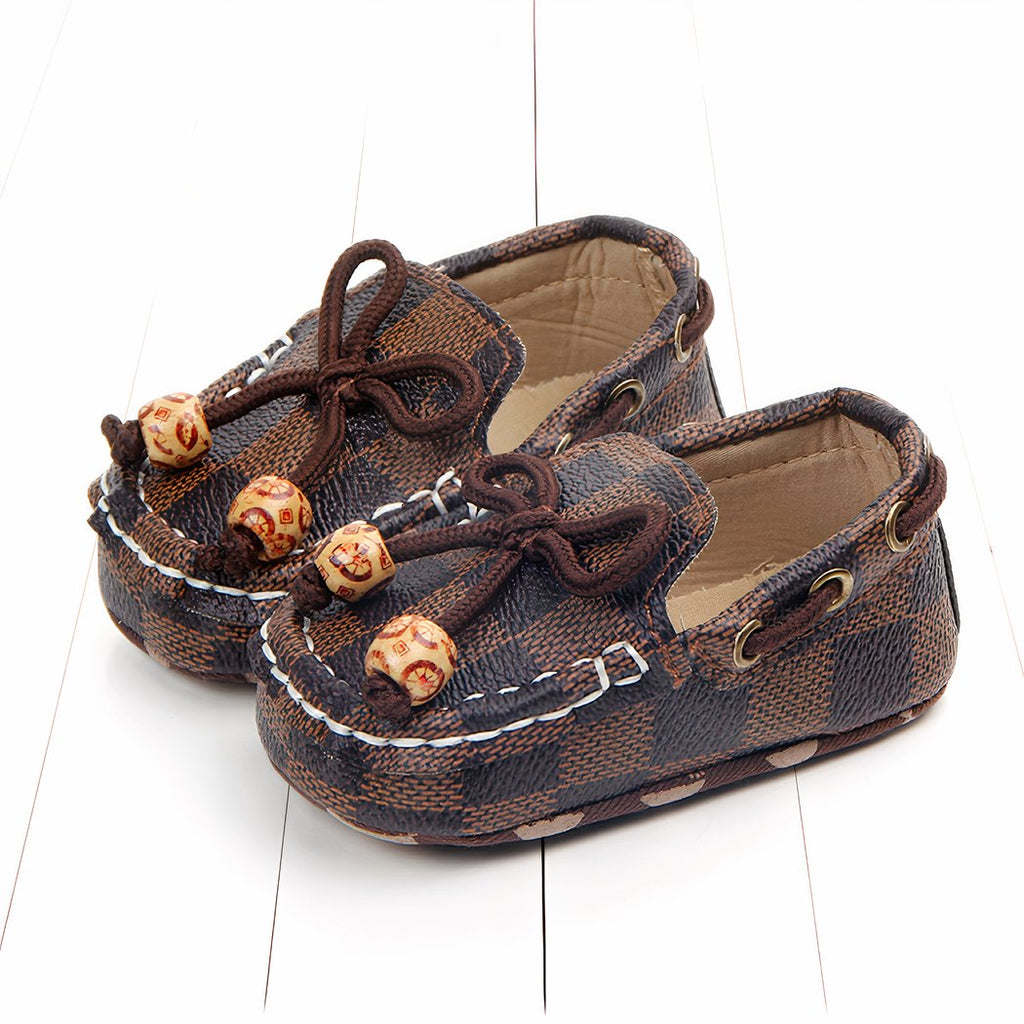 Trendy checkered baby moccasins with decorative beads