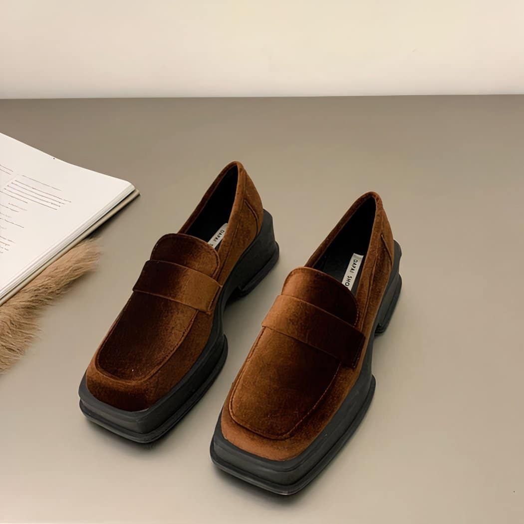 wedge loafer in brown velvet with square edge set on grey ground