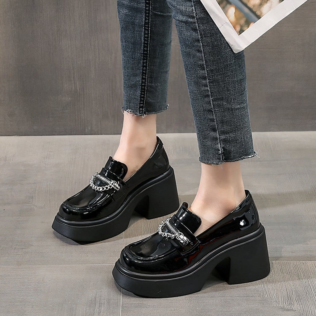 black loafer heel worn by a woman