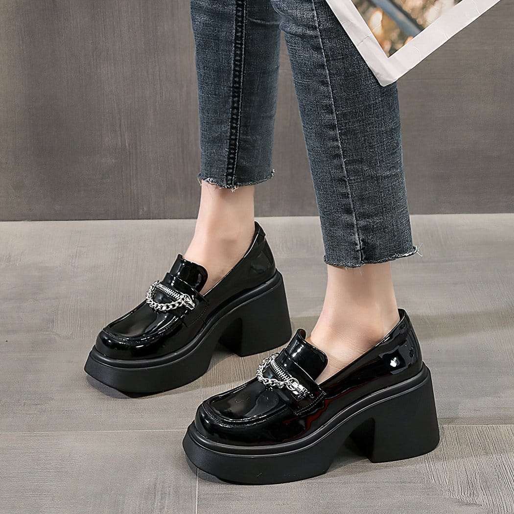 black loafer heel worn by a woman