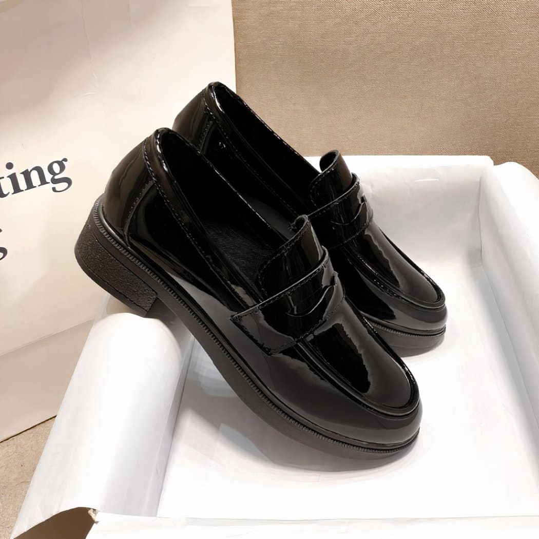 Women's black faux patent leather loafers with heels