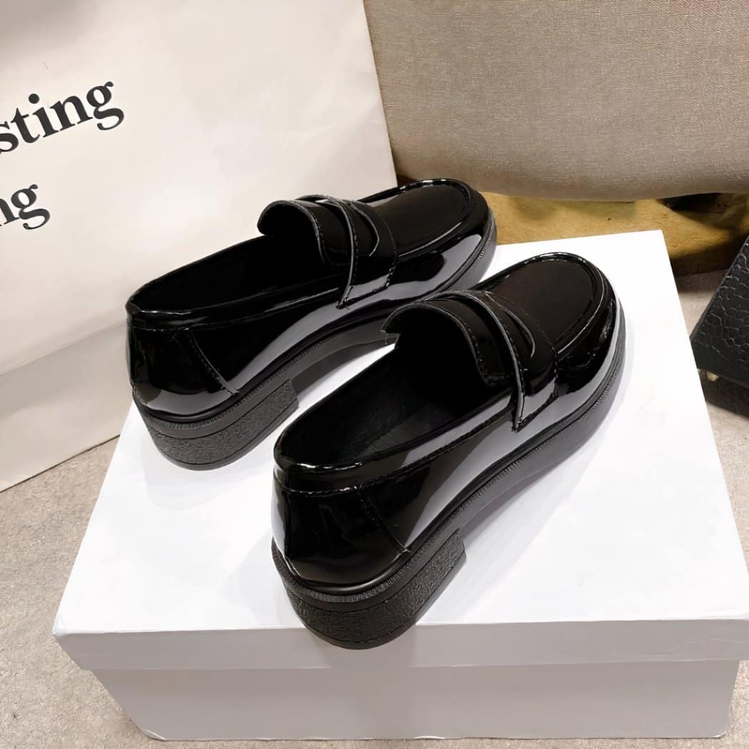 Women's black faux patent leather loafers with heels