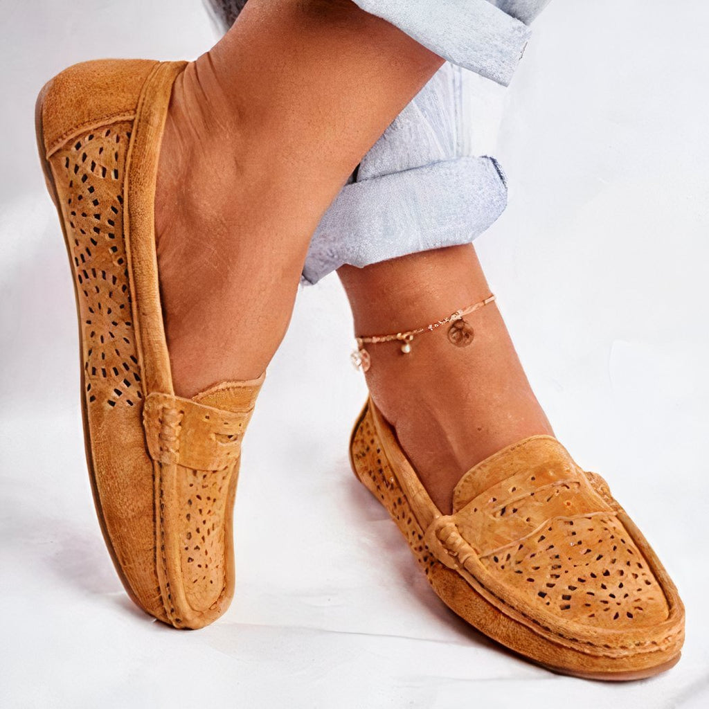 brown suede loafer worn by a woman