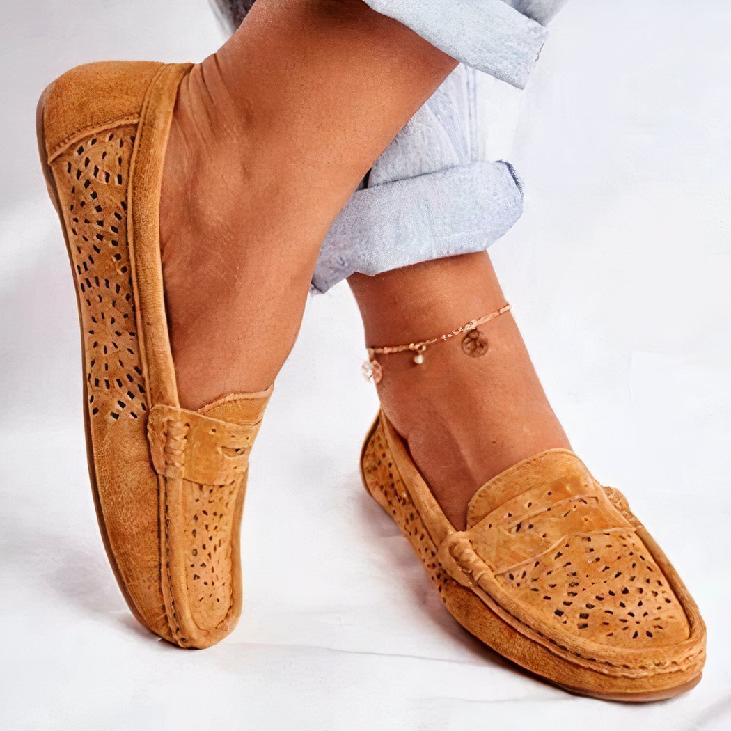 brown suede loafer worn by a woman with an ankle bracelet