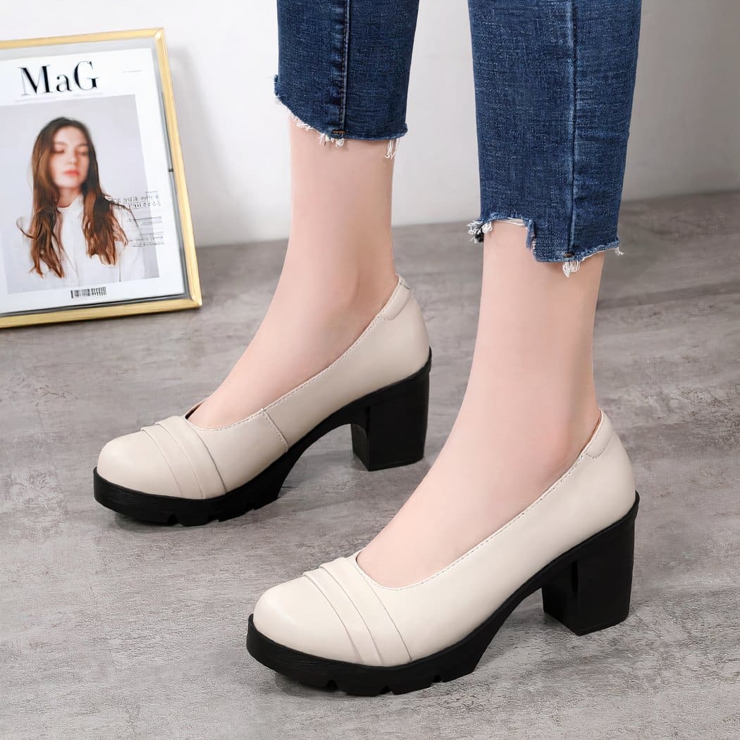 beige loafer worn by a woman