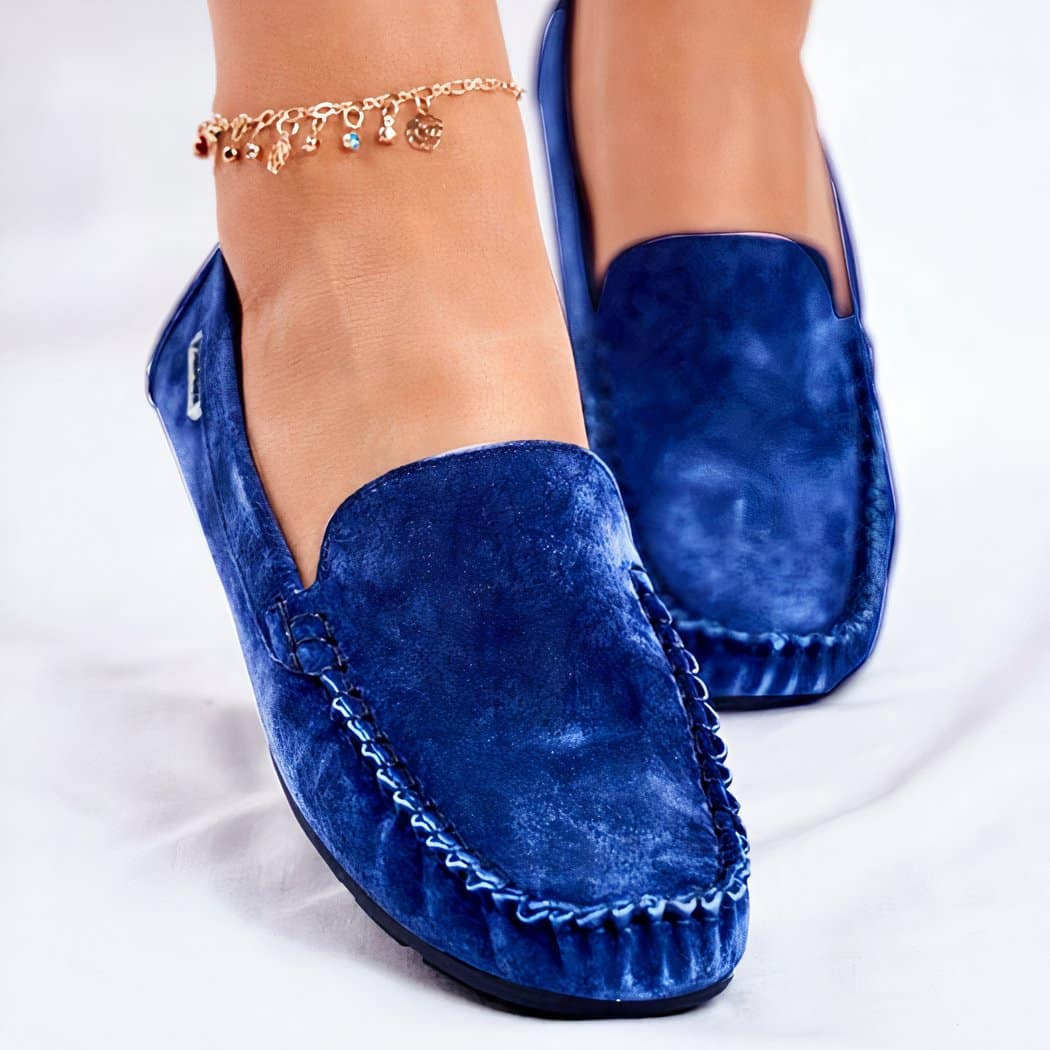 blue suede loafer worn by a woman