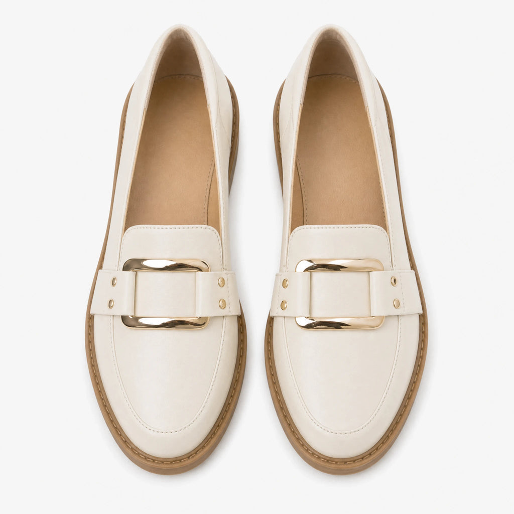 Women's beige moccasins with gold buckle, side view