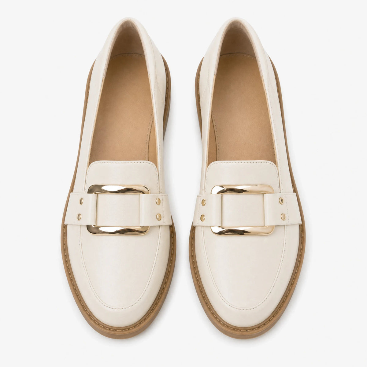 Women's beige moccasins with gold buckle, side view