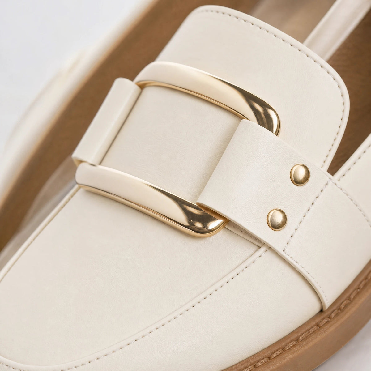 Creamy beige moccasin with square gold buckle Image