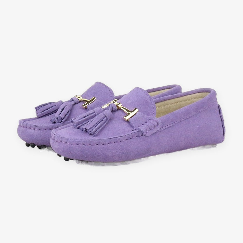 Women's leather tassel loafer with gold bit, orange styled with an outfit