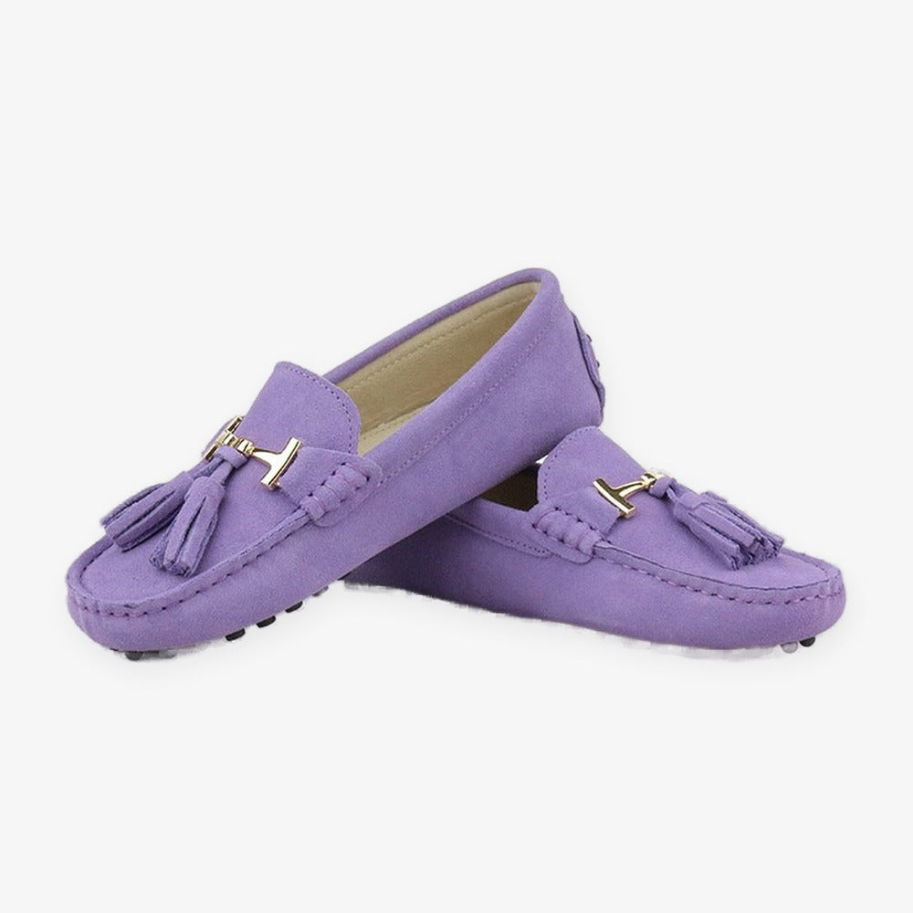 Women's leather tassel loafer with gold bit, yellow flat lay