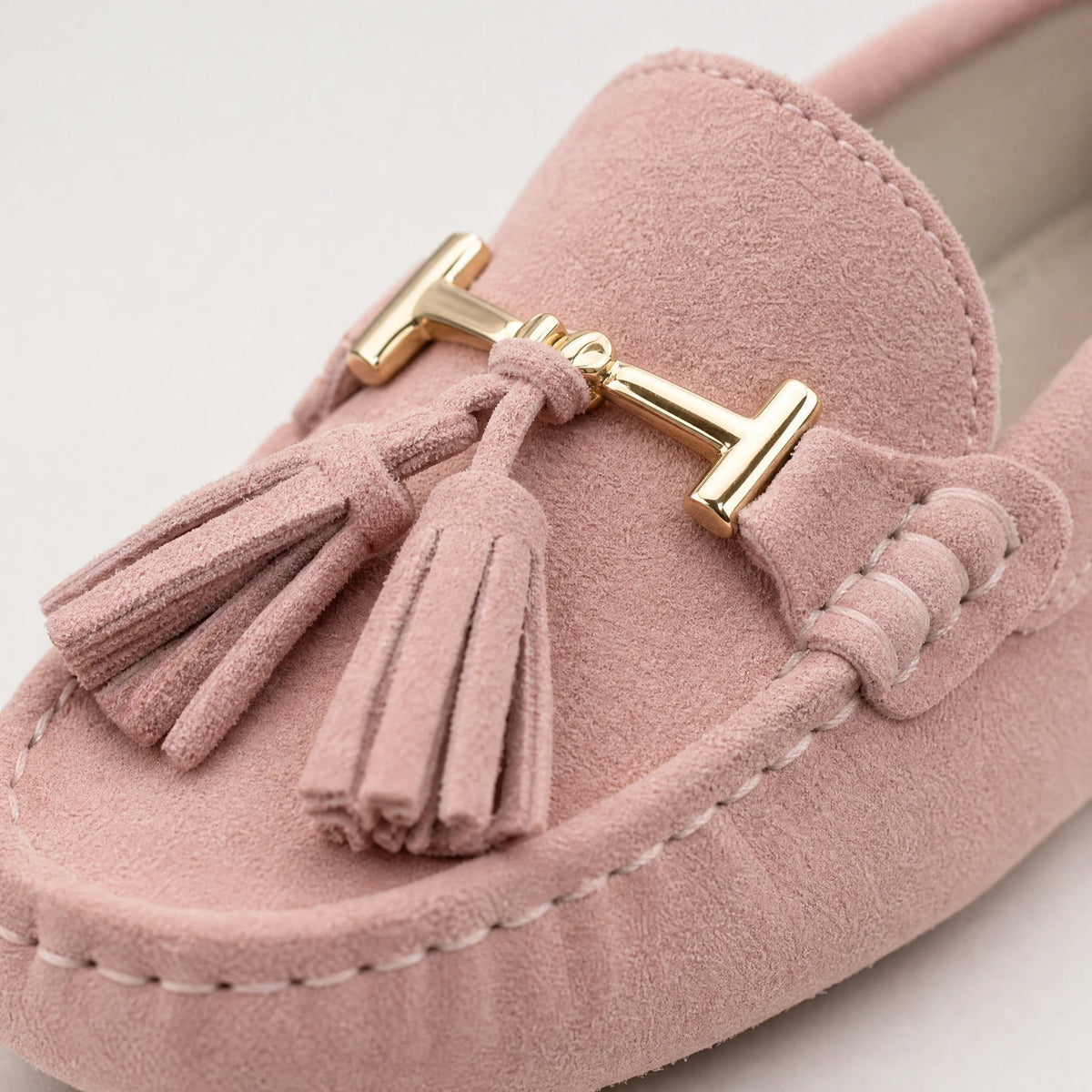 Women's leather tassel loafer with gold bit, pink side view