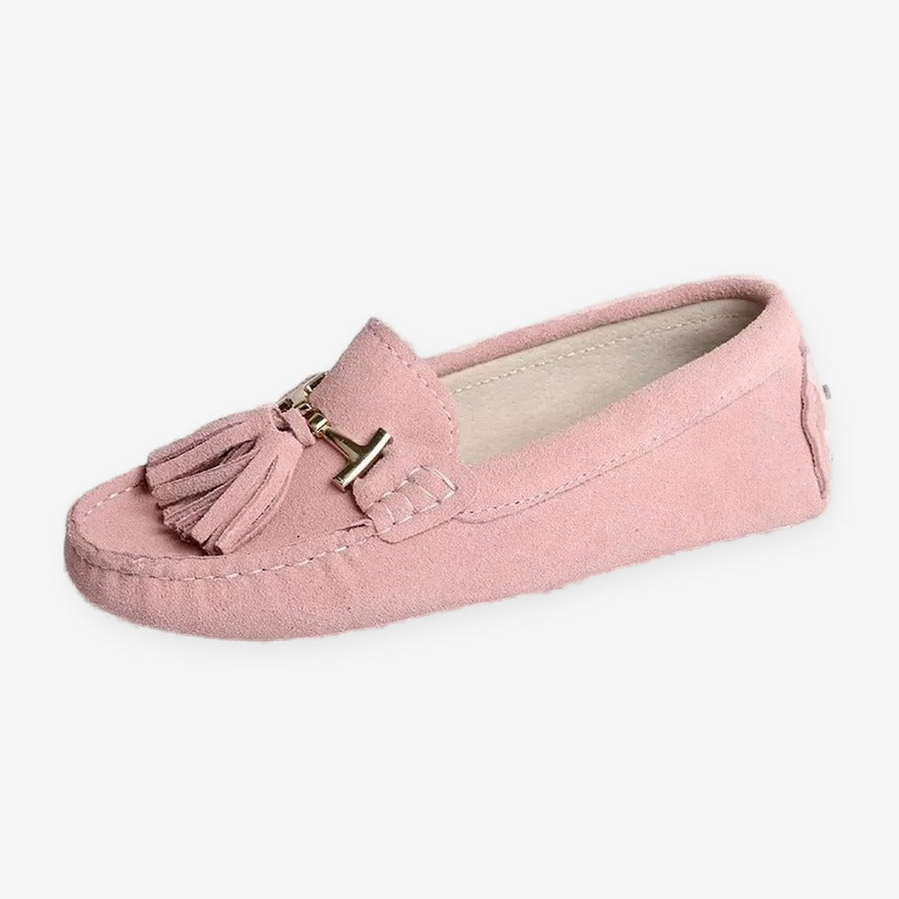Women's leather tassel loafer with gold bit, green worn on foot