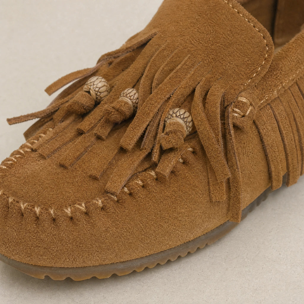 Fringe moccasins with decorative buckles