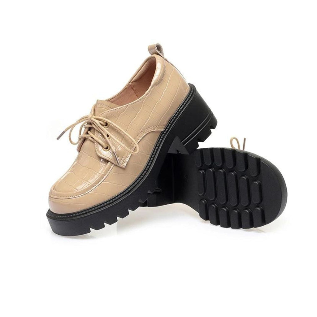 Back tab of the heeled moccasin
